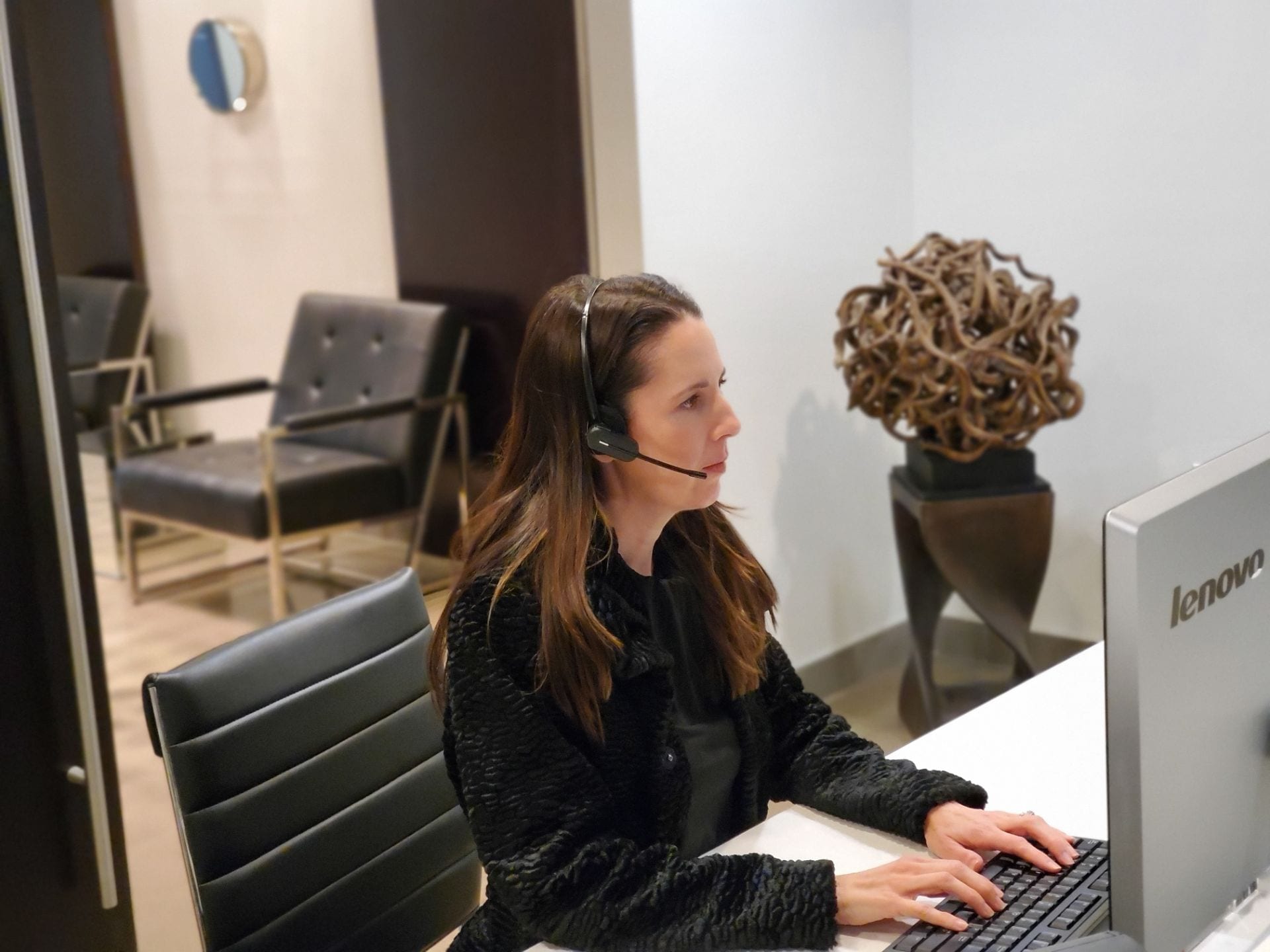 woman working at reception desk