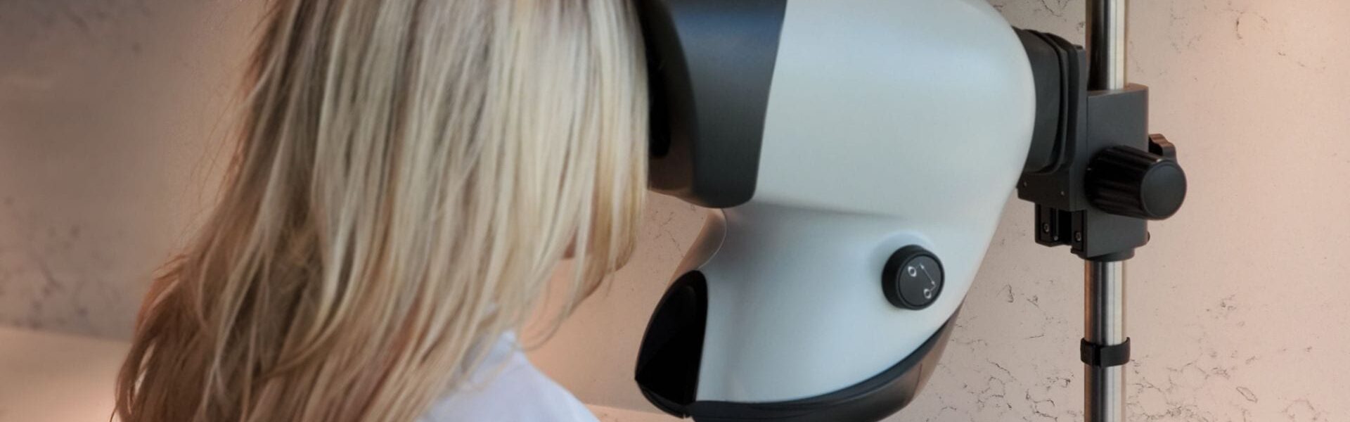 A woman conducting a hair restoration procedure